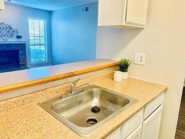 7621 McCallum Boulevard, Unit 108 Dallas, TX 75252 - Photo 5 of 26 a bathroom with a sink and a window
