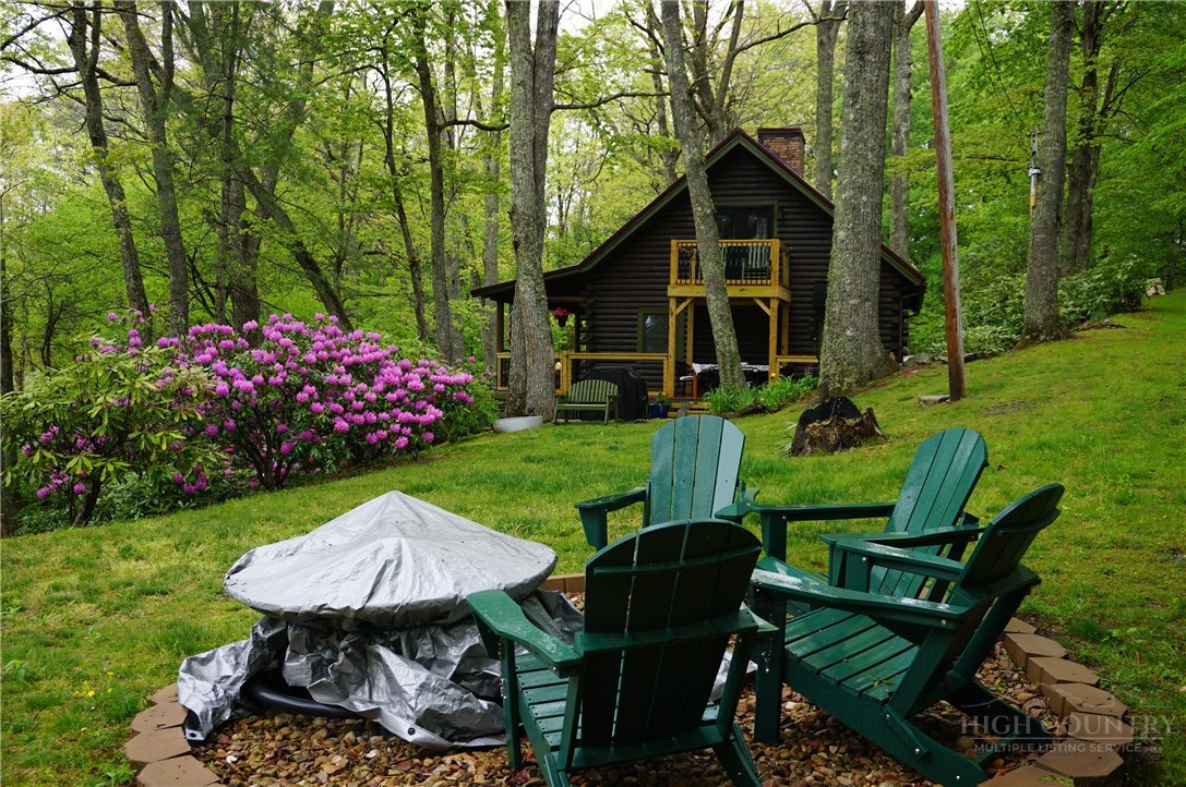 557 White Pine Road Newland, NC 28657 - Photo 2 of 41 a view of a chair and table in backyard of the house
