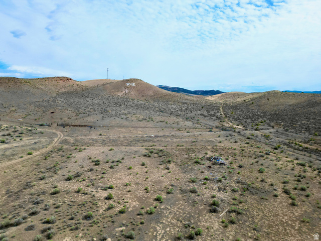 600 East E Street Moroni, UT 84646 - Photo 8 of 38 Expansive desert landscape featuring rolling hills and sparse vegetation
