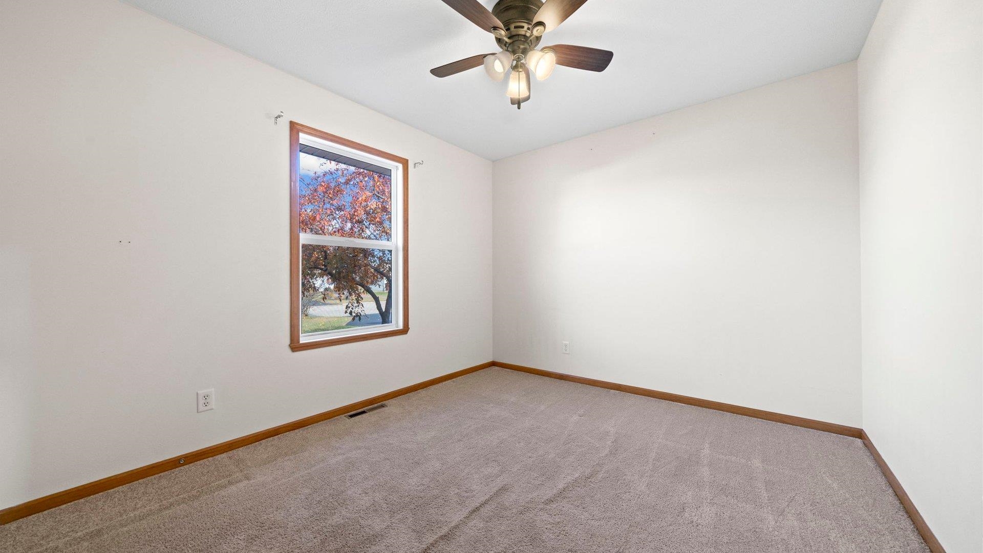 658 Cassandra Way South Beloit, IL 61080 - Photo 15 of 25 an empty room with windows and fan