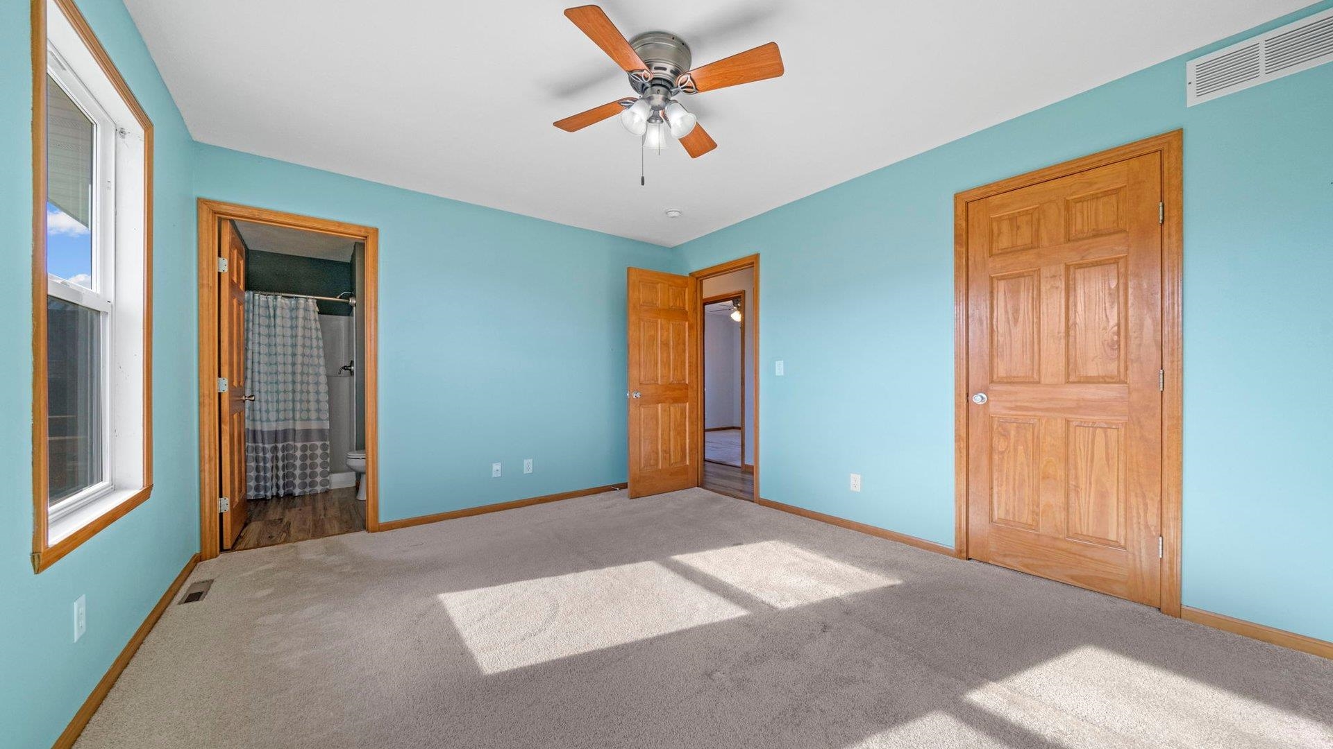 658 Cassandra Way South Beloit, IL 61080 - Photo 18 of 25 an empty room with windows and fan