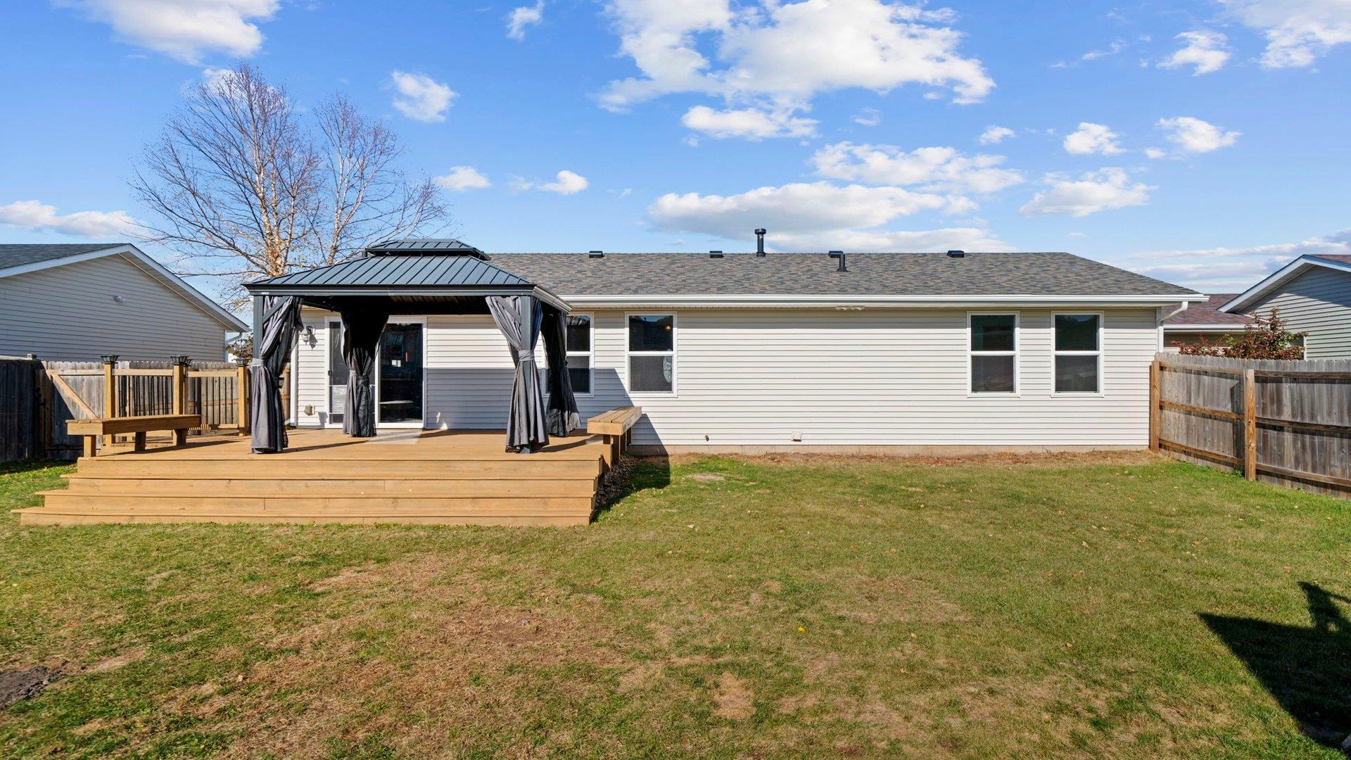 658 Cassandra Way South Beloit, IL 61080 - Photo 23 of 25 a front view of a house with garden