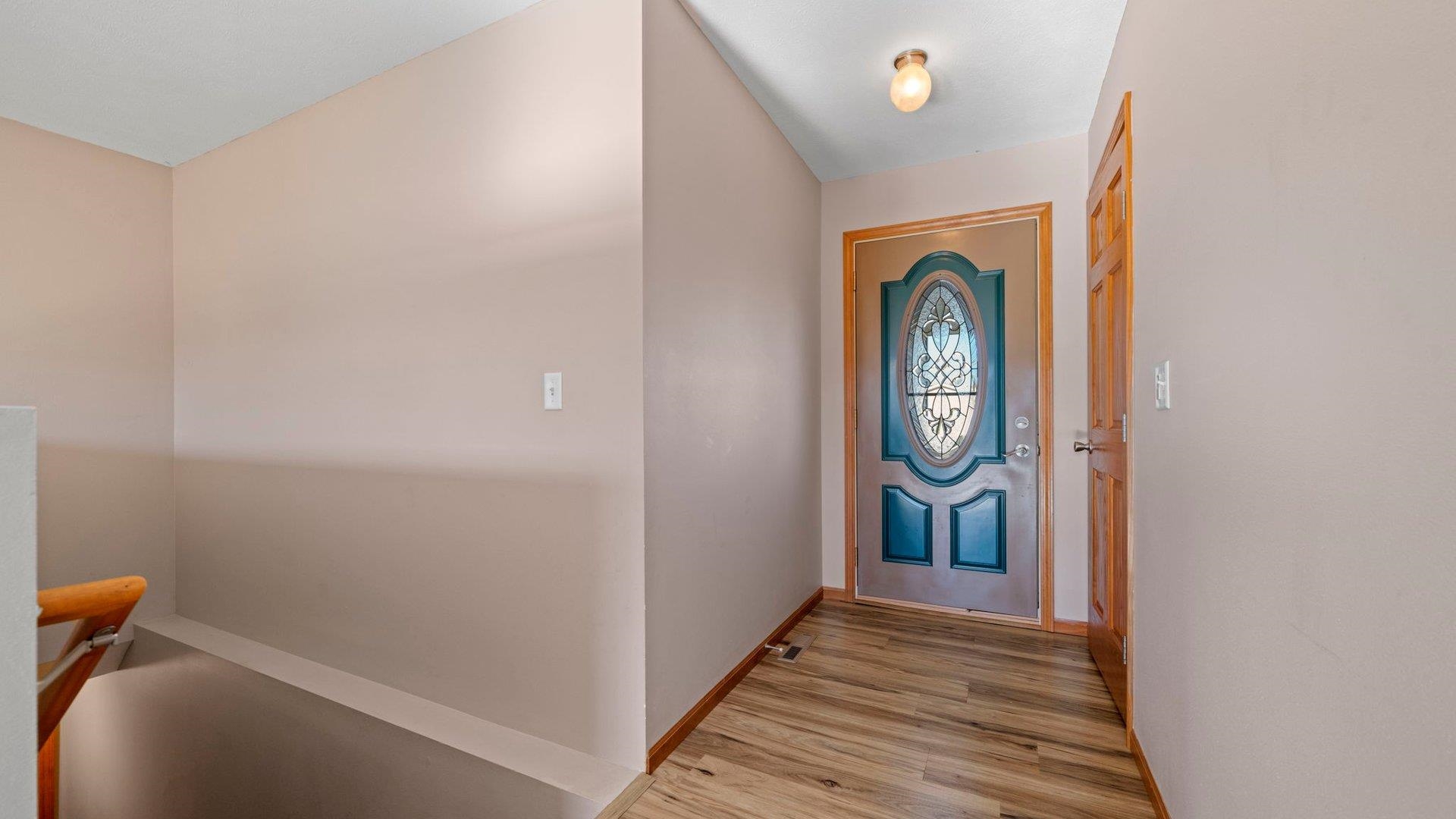 658 Cassandra Way South Beloit, IL 61080 - Photo 3 of 25 a view of hallway with wooden floor