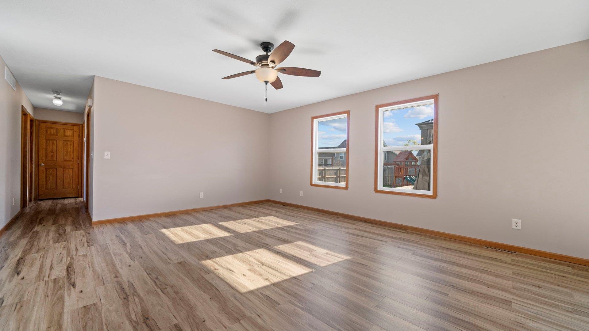 658 Cassandra Way South Beloit, IL 61080 - Photo 5 of 25 wooden floor in an empty room with a window
