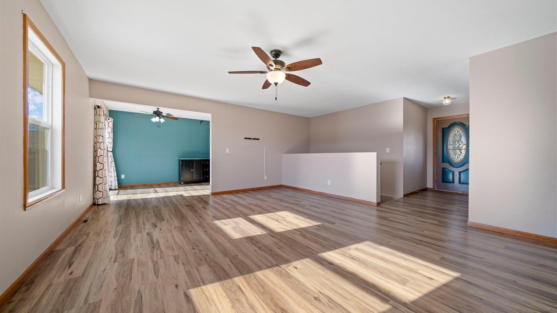 658 Cassandra Way South Beloit, IL 61080 - Photo 6 of 25 wooden floor in an empty room with a window