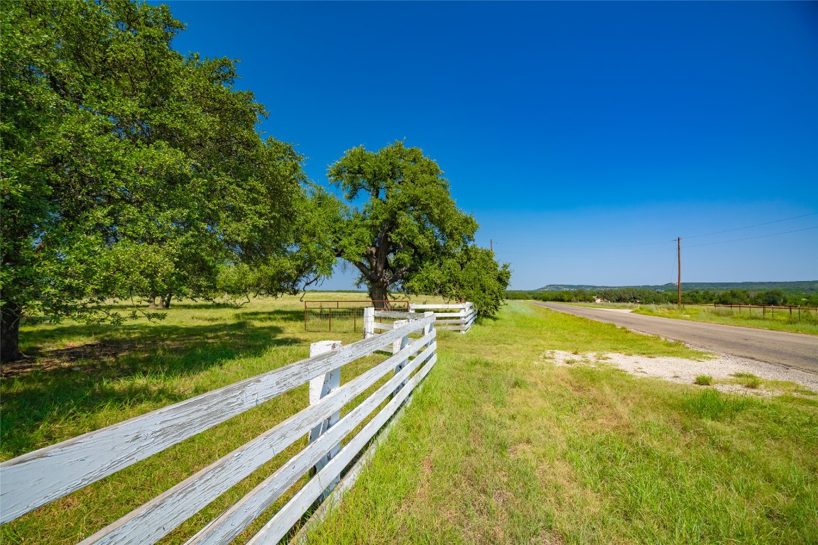 4 County Road 228 Florence, TX 76527 - Photo 17 of 18 a view of a swimming pool with an outdoor seating and a yard