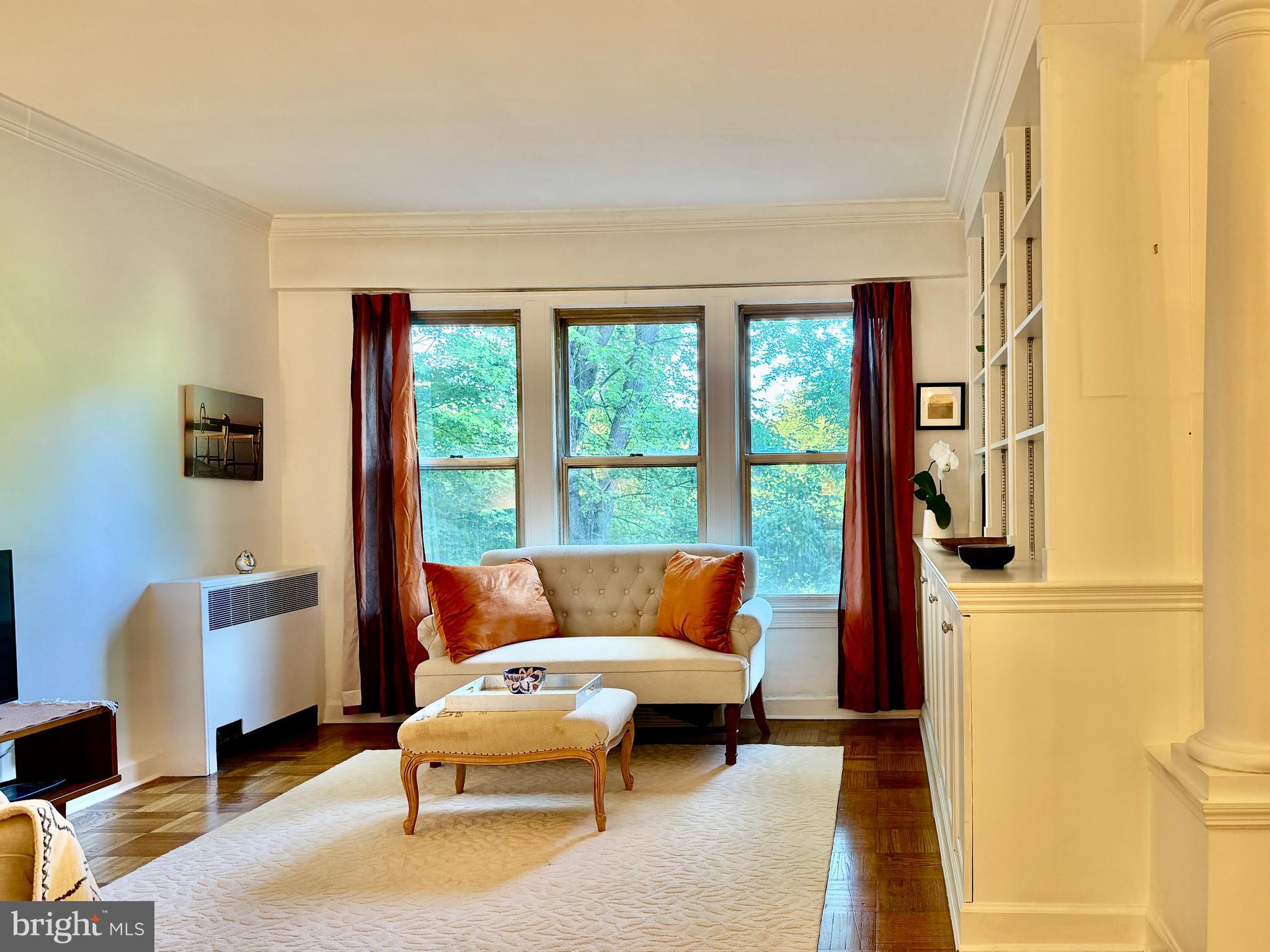 2500 Q Street Northwest, Unit 307 Washington, DC 20007 - Photo 5 of 17 a living room with furniture and a window