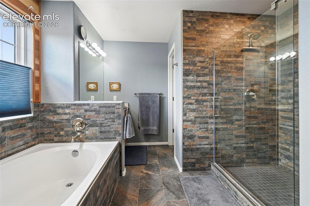 12571 Scamper Road Peyton, CO 80831 - Photo 19 of 49 Soaking tub, stand alone tile shower, double vanities