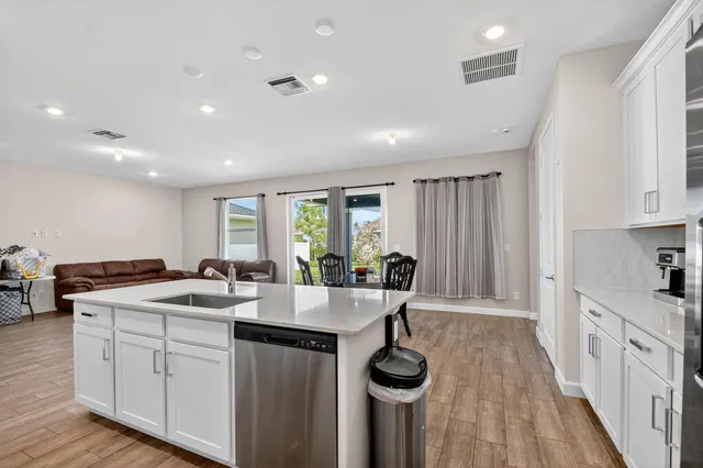 a view of walk in closet with clothes