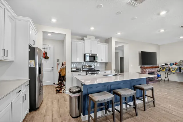 a bedroom with a bed and a desk