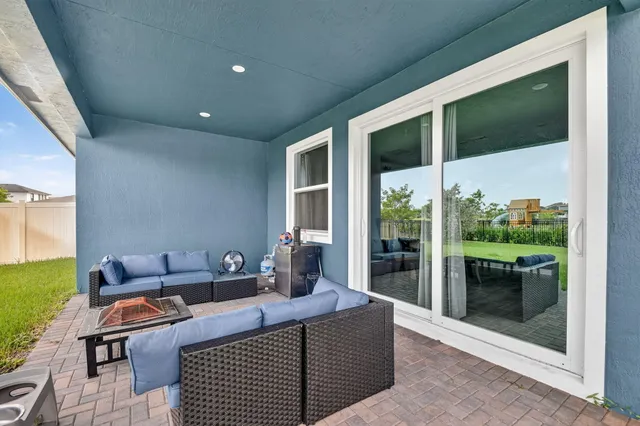 a view of a park with a house in the background