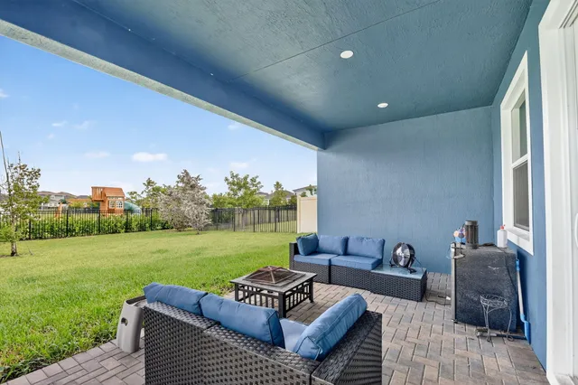 a view of a play house with a backyard and a garden