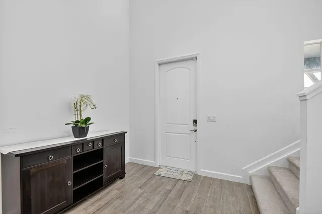 a kitchen with sink refrigerator and microwave