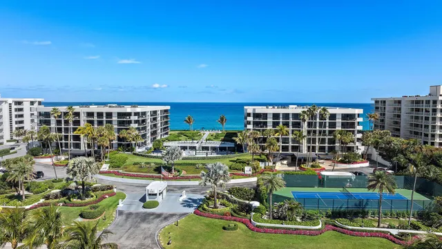 a front view of a building with outdoor seating