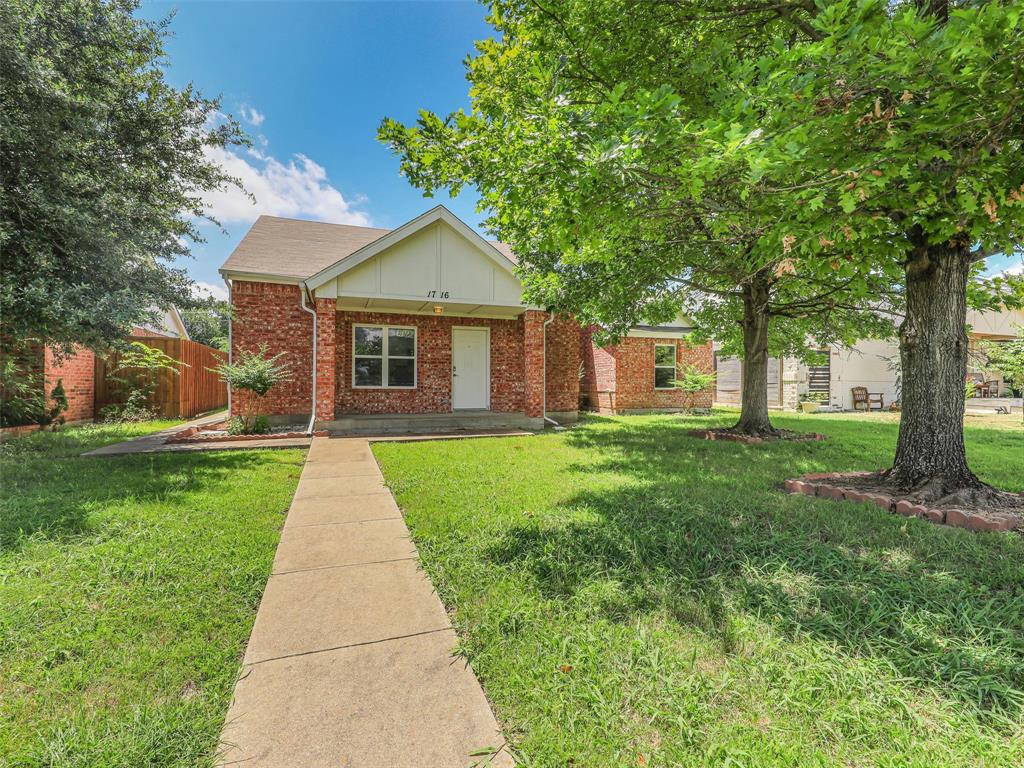 1716 East Parker Road Plano, TX 75074 - Photo 1 of 25 Brick exterior featuring white trim and a white front door