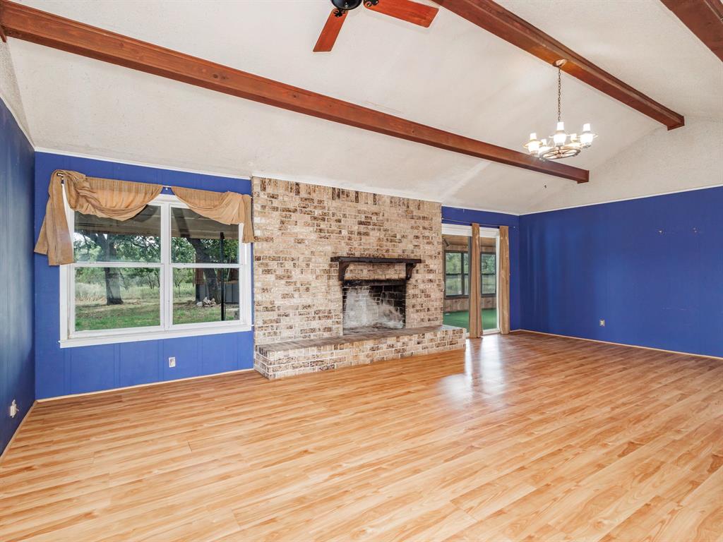 2415 Fm 2805 Talpa, TX 76882 - Photo 12 of 36 a view of empty room with wooden floor and fan