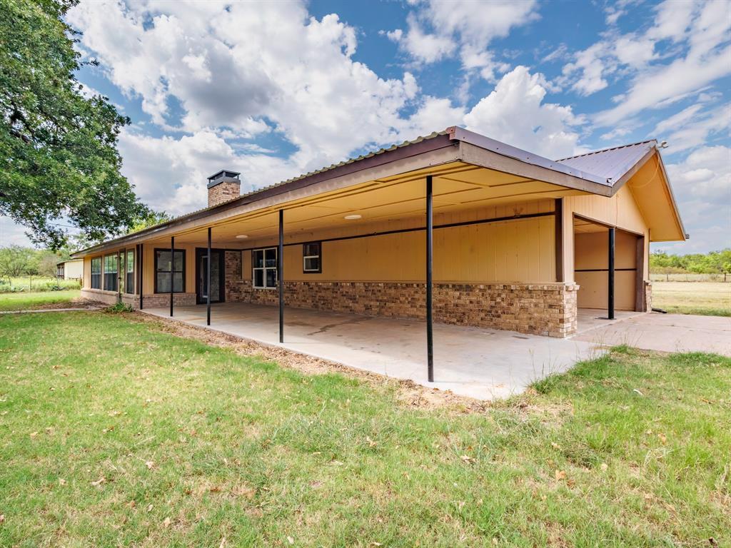 2415 Fm 2805 Talpa, TX 76882 - Photo 5 of 36 a view of a house with a big yard and a patio