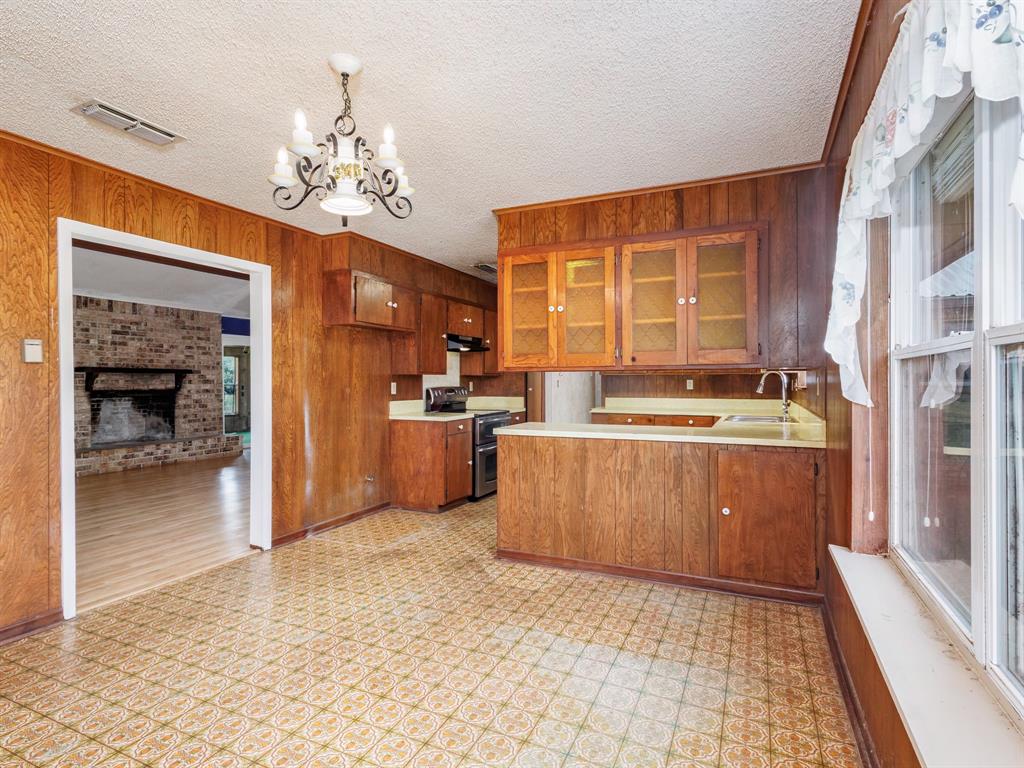 2415 Fm 2805 Talpa, TX 76882 - Photo 7 of 36 a kitchen with stainless steel appliances granite countertop a refrigerator and a sink