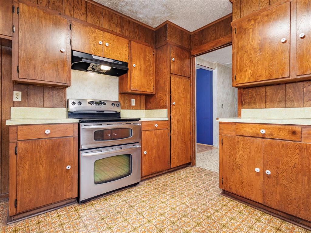 2415 Fm 2805 Talpa, TX 76882 - Photo 8 of 36 a kitchen with a stove top oven cabinets and a refrigerator