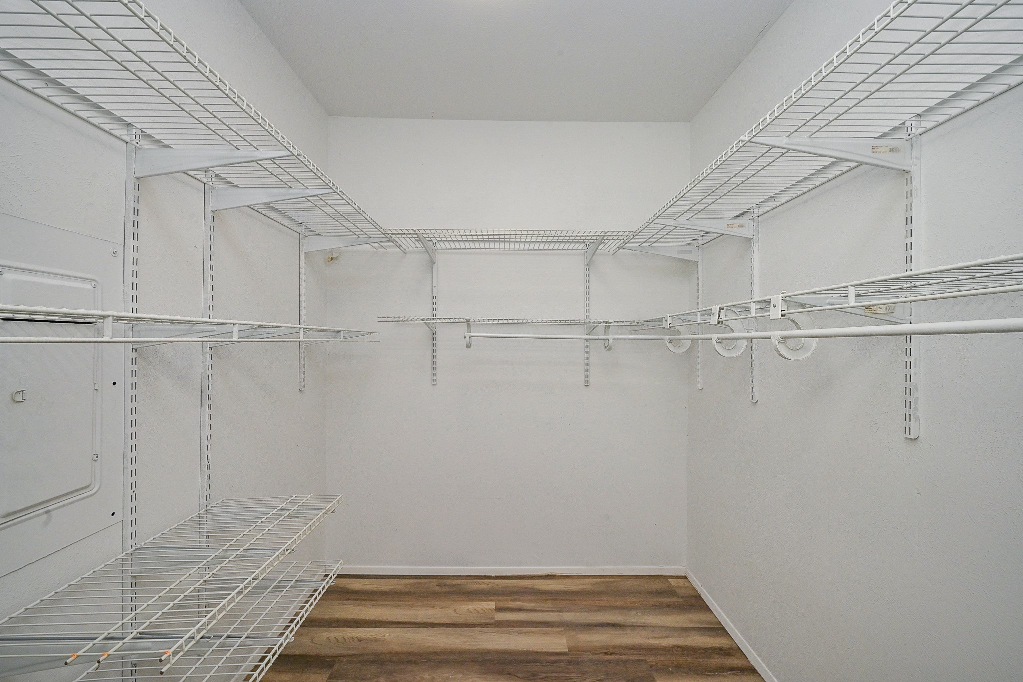 18318 Navajo Trail Drive Spring, TX 77388 - Photo 12 of 16 Walk-in closet with built-in shelving and ample hanging space.