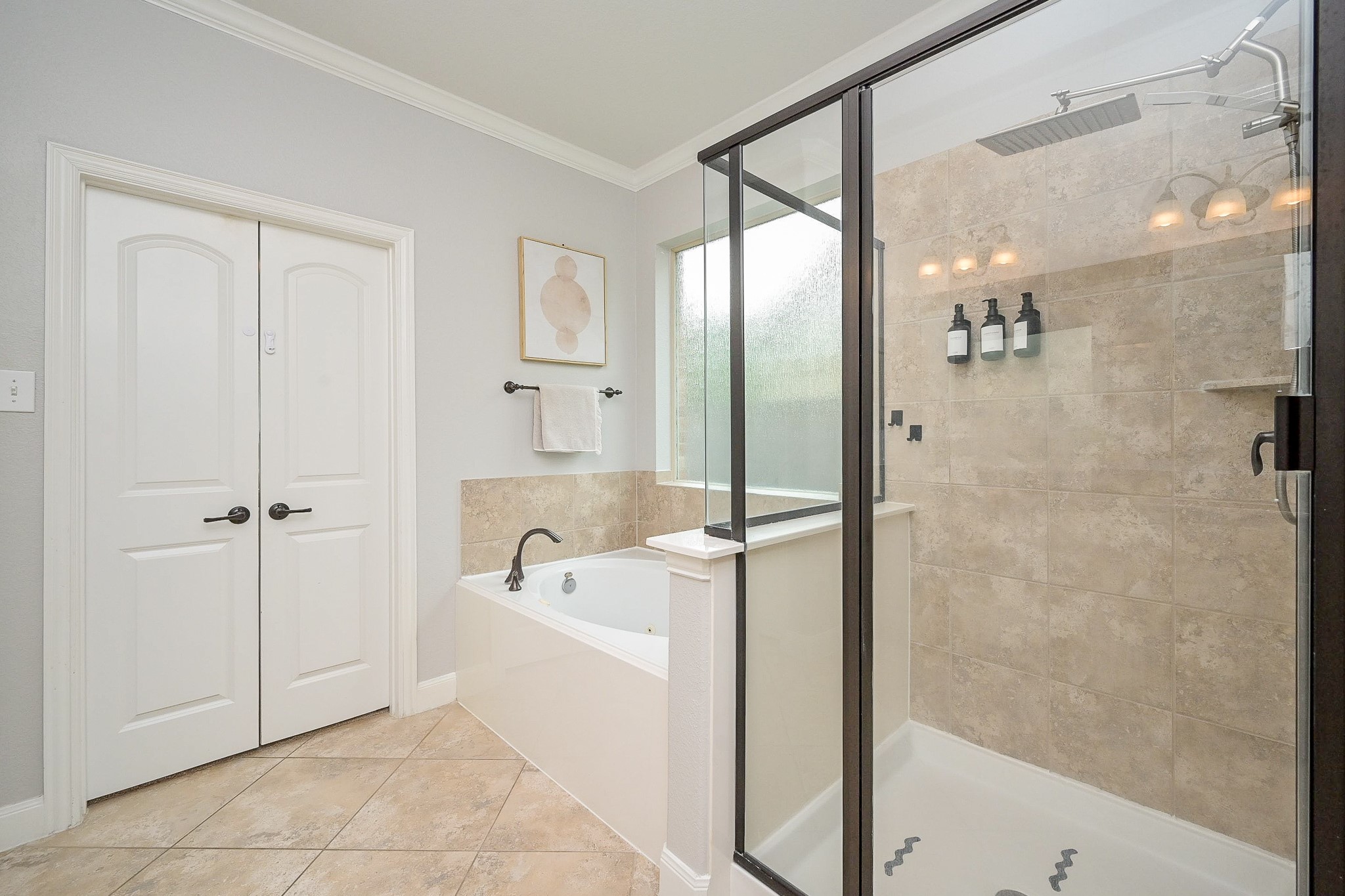 11 South Victoriana Circle Spring, TX 77389 - Photo 21 of 38 a bathroom with a bathtub a shower and a glass door