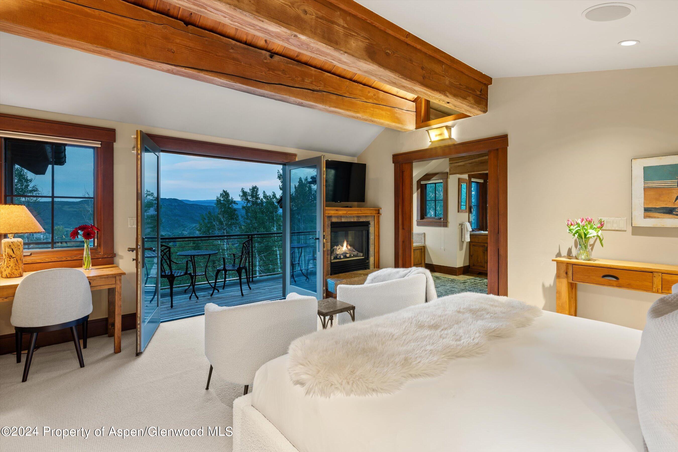 1021 Two Creeks Drive Snowmass Village, CO 81615 - Photo 17 of 47 a bedroom with furniture and a large window