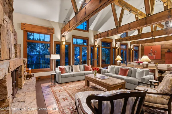 a outdoor living space with patio furniture and a large window