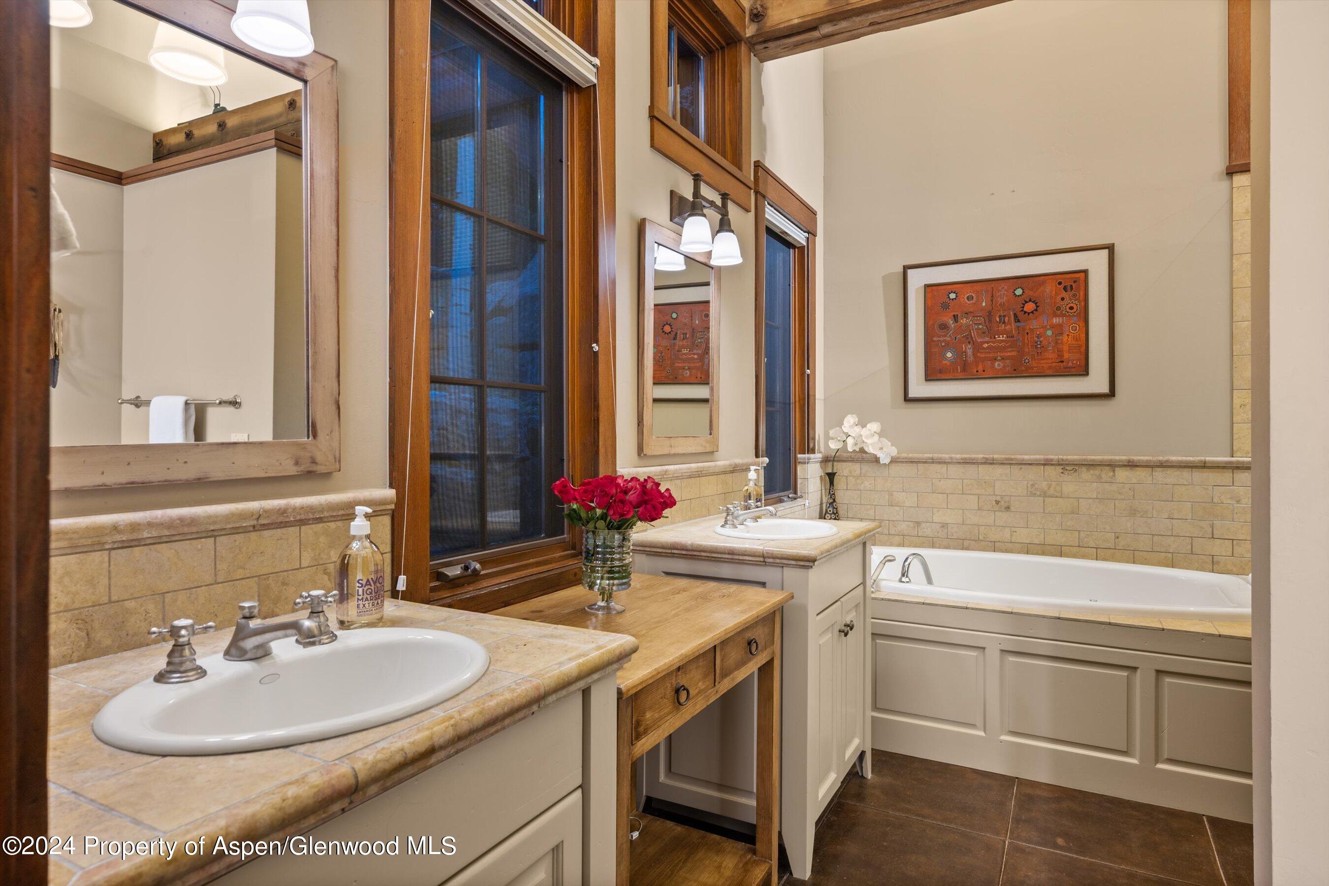 1021 Two Creeks Drive Snowmass Village, CO 81615 - Photo 24 of 47 a bathroom with a sink and a mirror