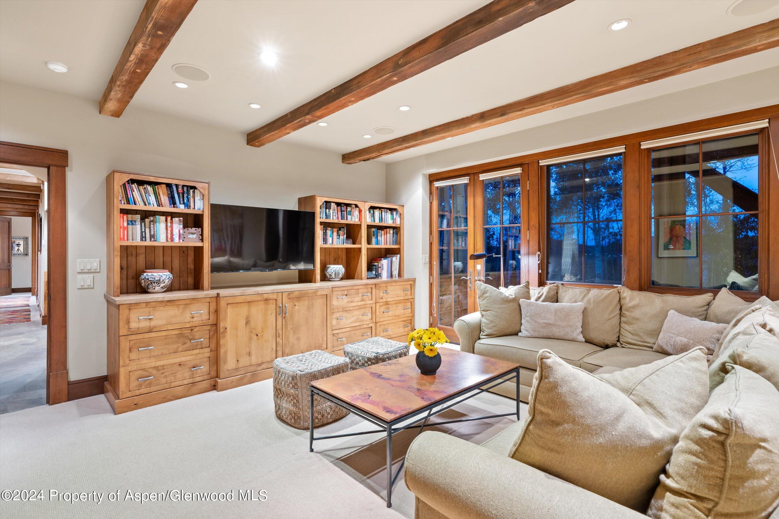1021 Two Creeks Drive Snowmass Village, CO 81615 - Photo 25 of 47 a living room with furniture kitchen view and a window