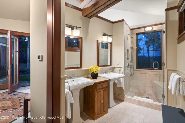 a bathroom with a sink a washer and dryer