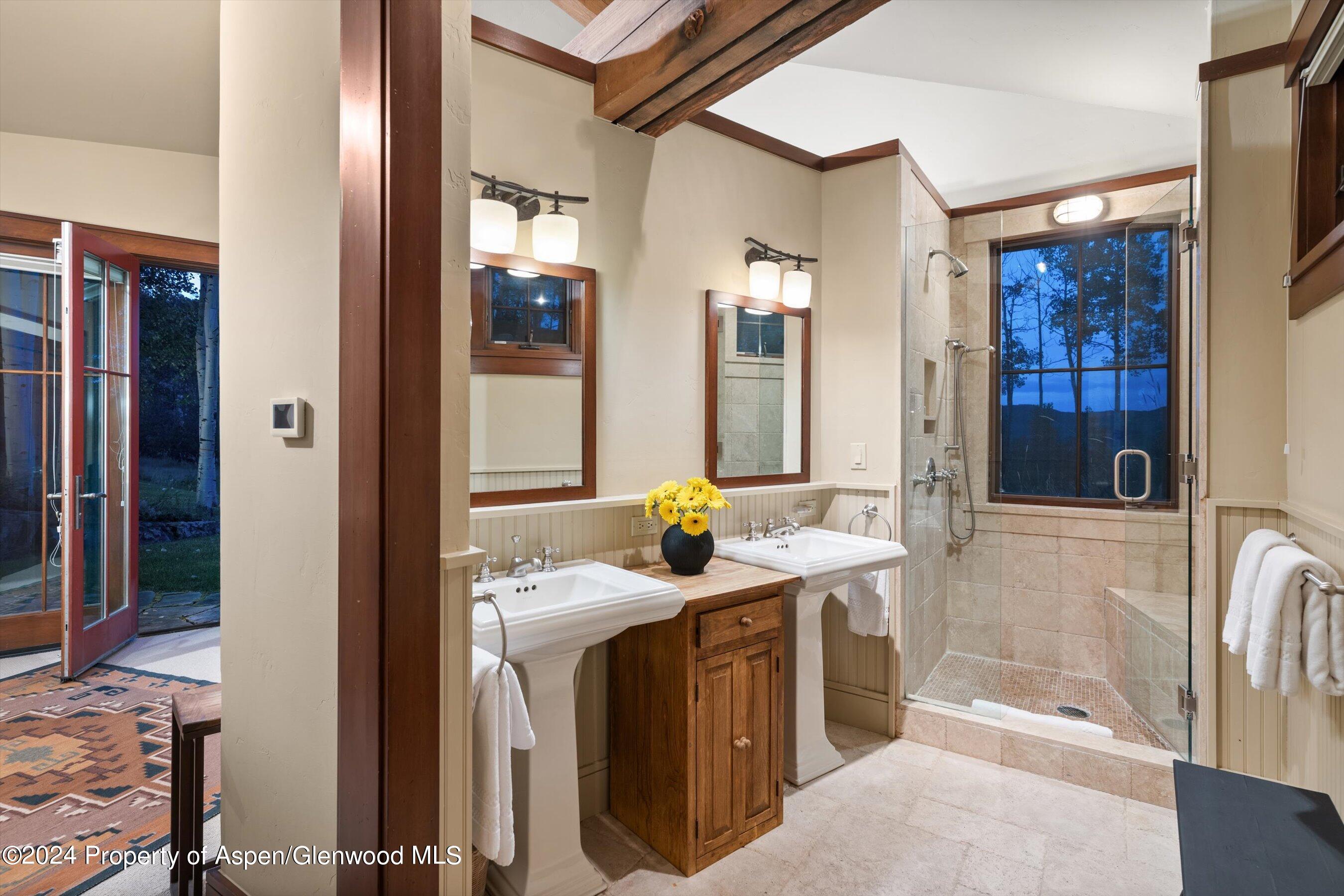 1021 Two Creeks Drive Snowmass Village, CO 81615 - Photo 30 of 47 a bathroom with a sink a washer and dryer