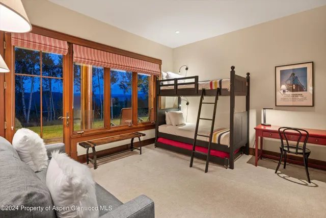 a bedroom with furniture and rug floor