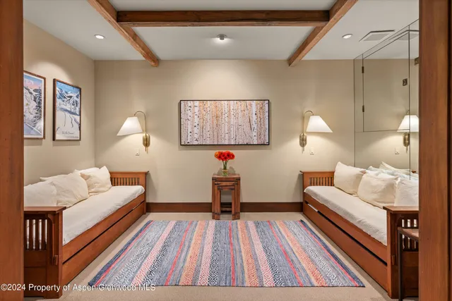 a living room with furniture and a rug