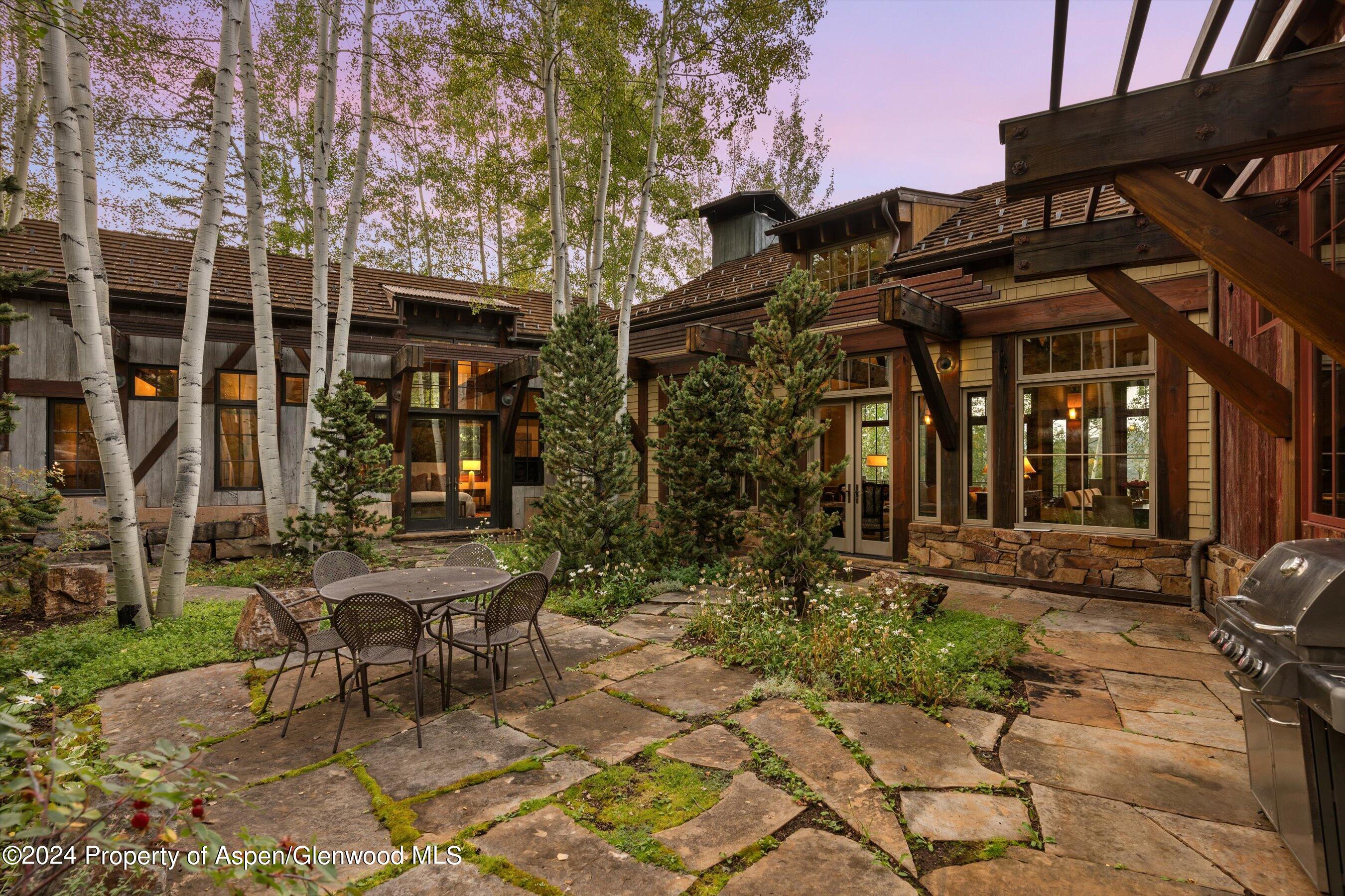1021 Two Creeks Drive Snowmass Village, CO 81615 - Photo 41 of 47 a view of a building with sitting area