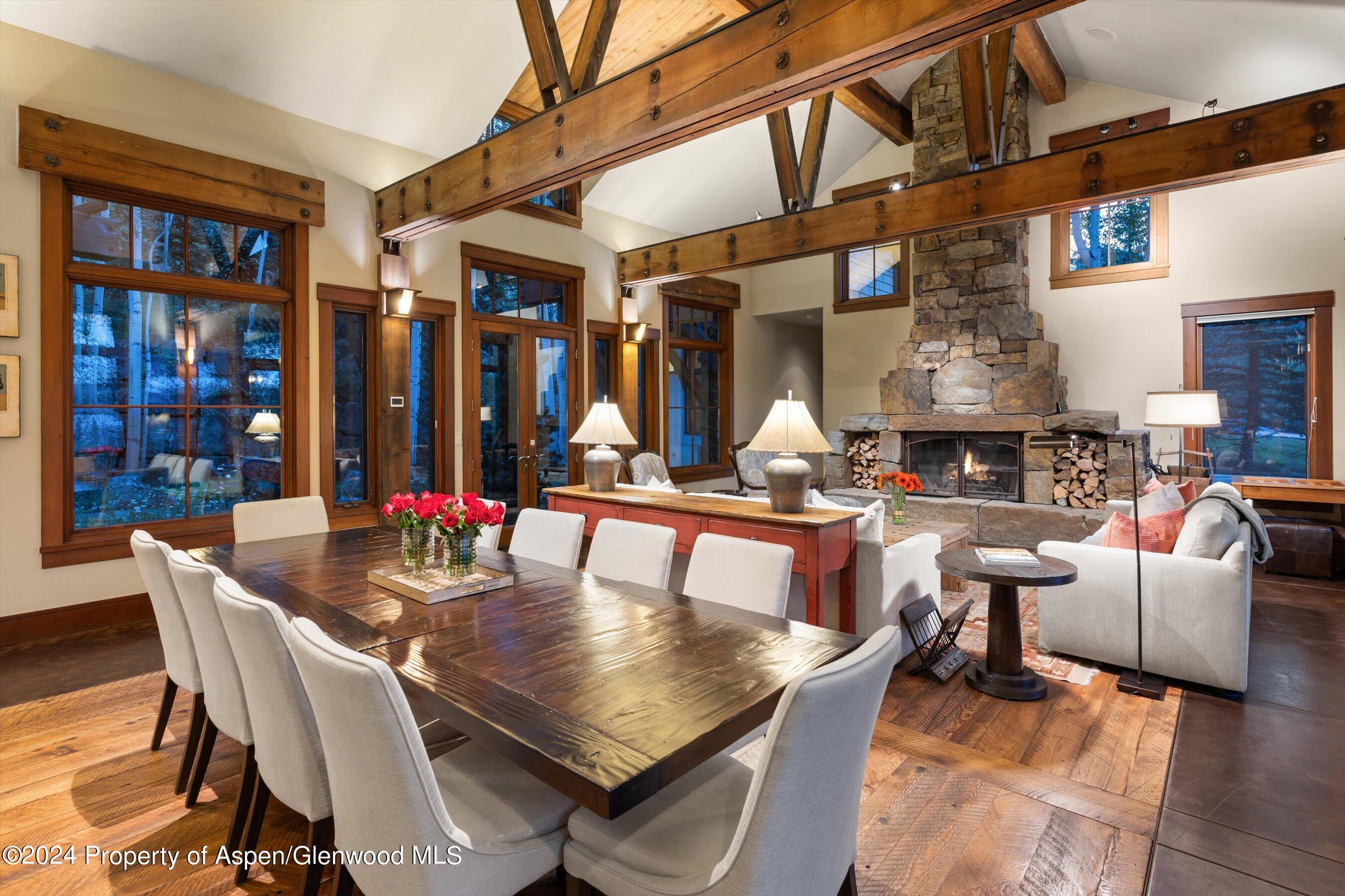 1021 Two Creeks Drive Snowmass Village, CO 81615 - Photo 6 of 47 a dining room with furniture a rug and wooden floor