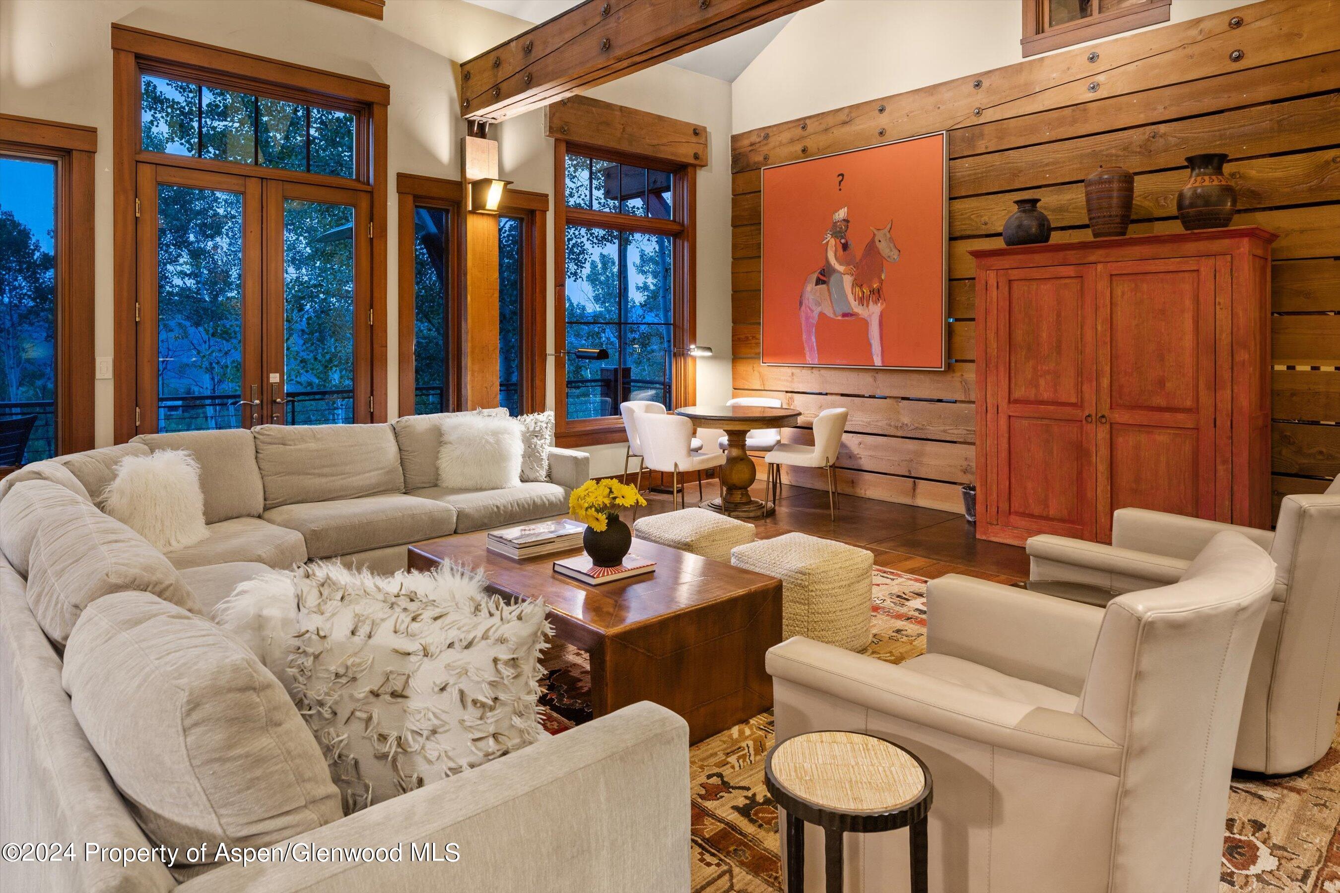 1021 Two Creeks Drive Snowmass Village, CO 81615 - Photo 7 of 47 a living room with furniture and large window