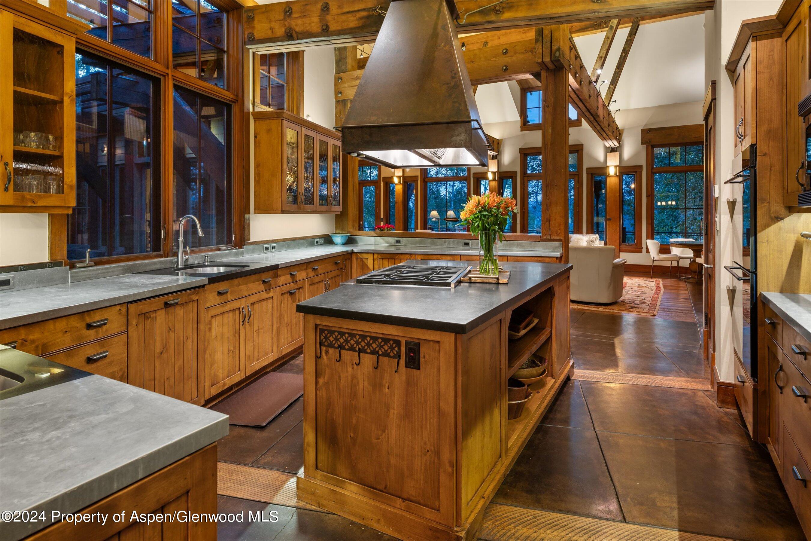 1021 Two Creeks Drive Snowmass Village, CO 81615 - Photo 10 of 47 a view of a kitchen with a sink and a stove
