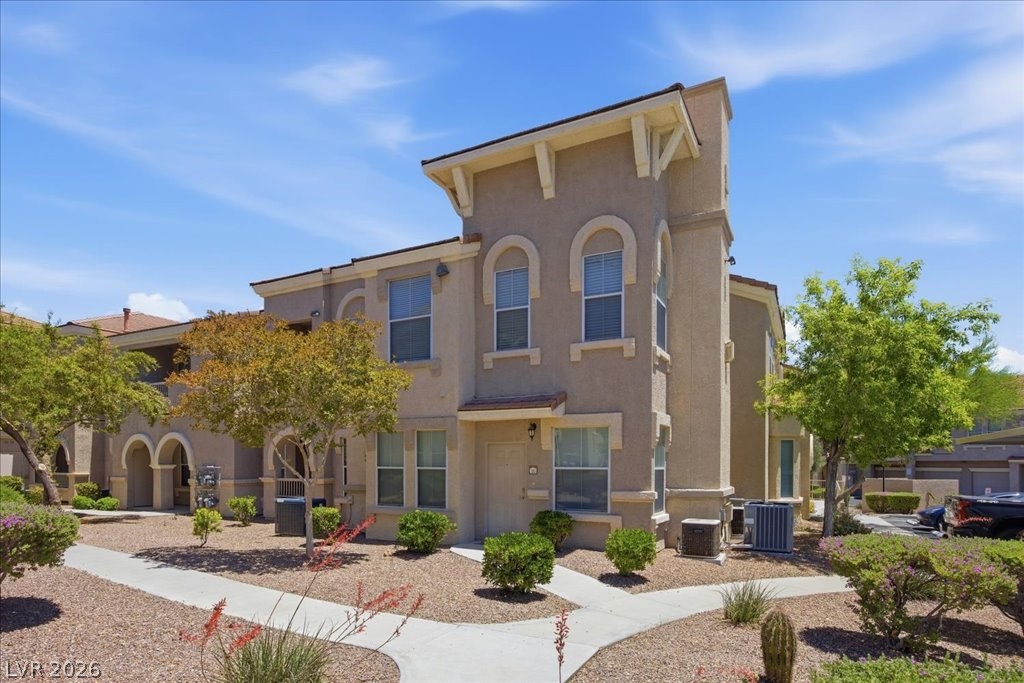10550 West Alexander Road, Unit 2164 Las Vegas, NV 89129 - Photo 1 of 27 A desert-friendly landscape surrounds this multi-level property, offering a warm and inviting curb appeal.