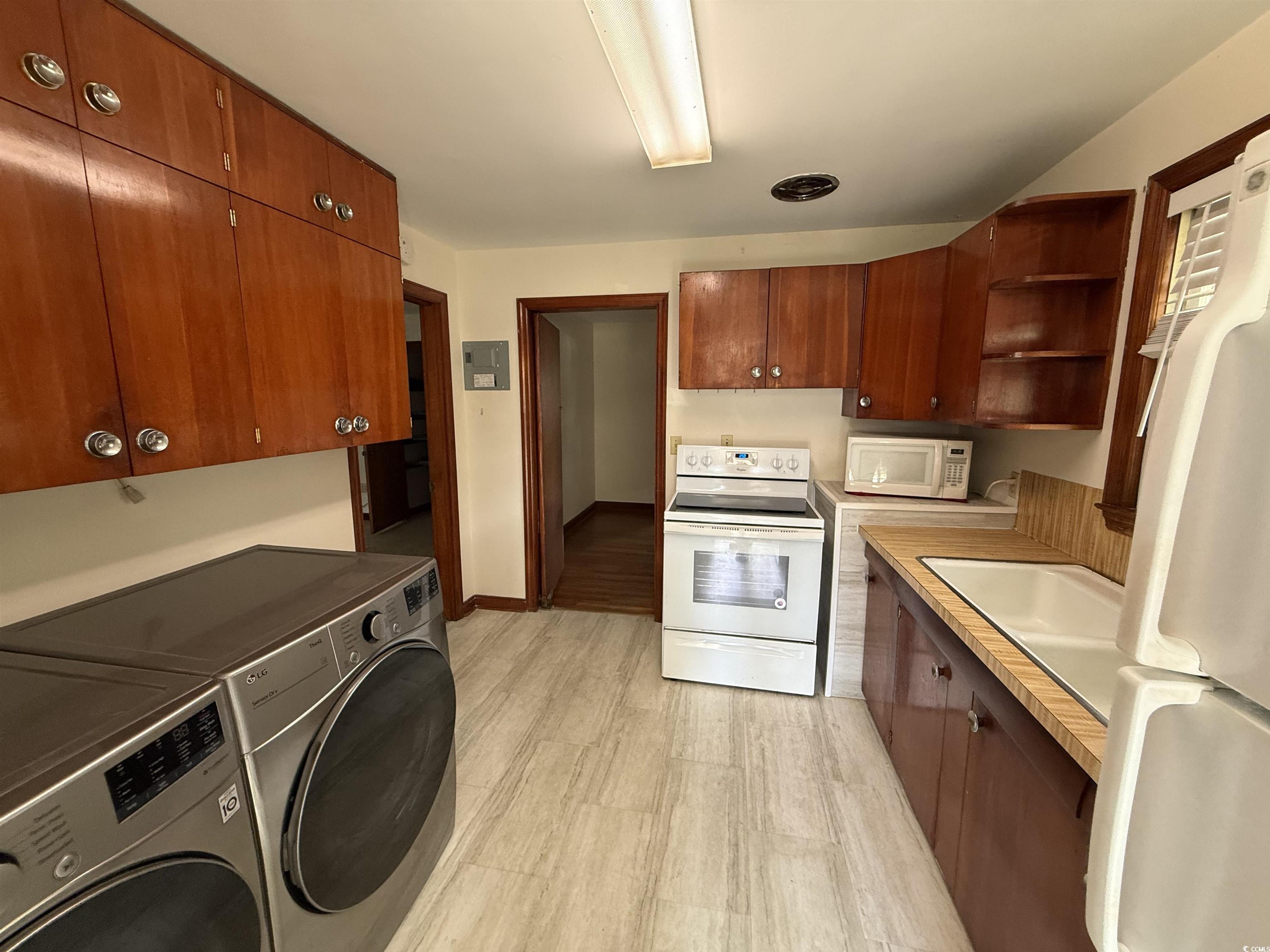 1208 Richmond Drive Georgetown, SC 29440 - Photo 2 of 9 Kitchen with light countertops, open shelves, whit