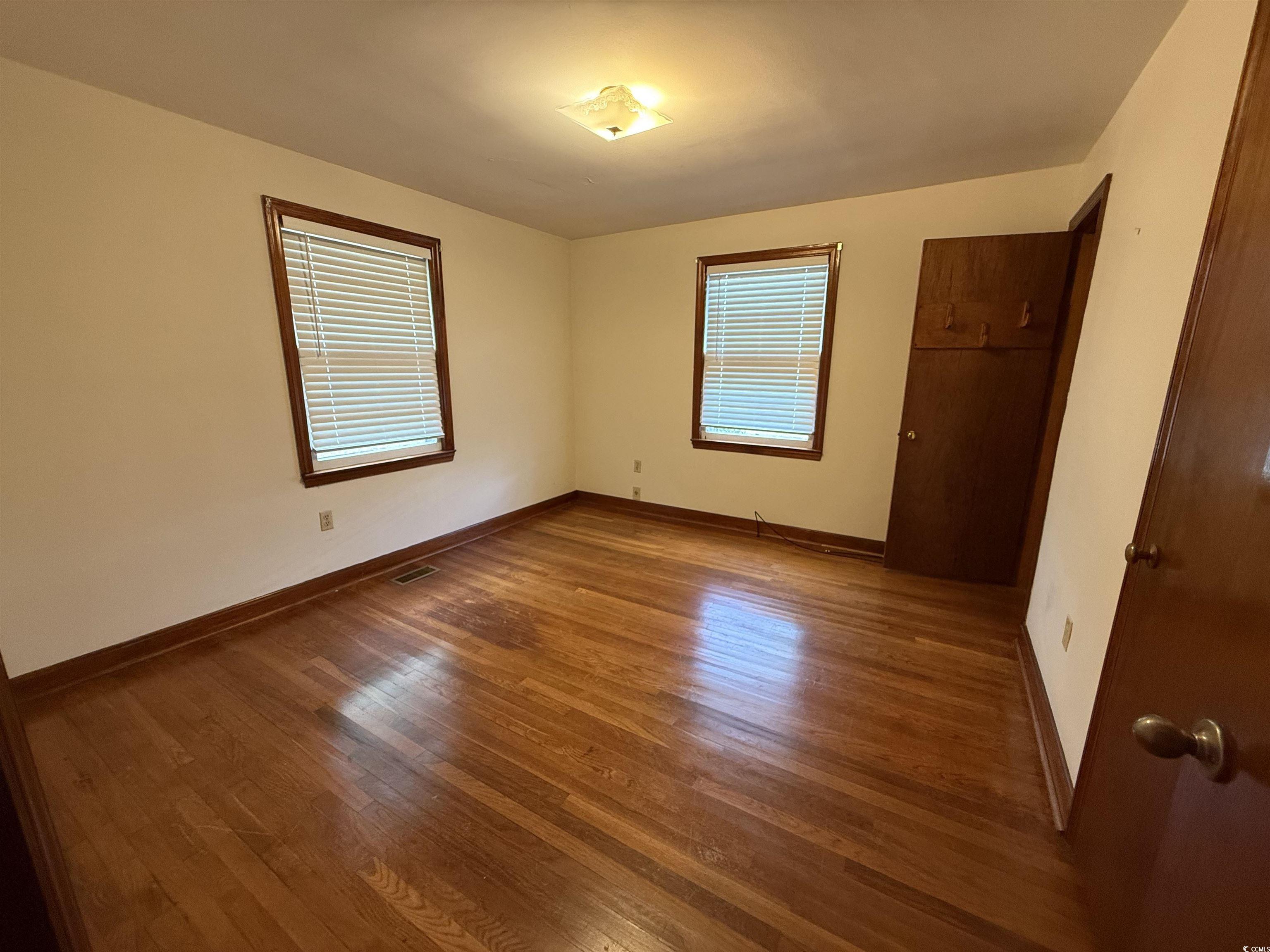 1208 Richmond Drive Georgetown, SC 29440 - Photo 6 of 9 Unfurnished bedroom with visible vents, baseboards