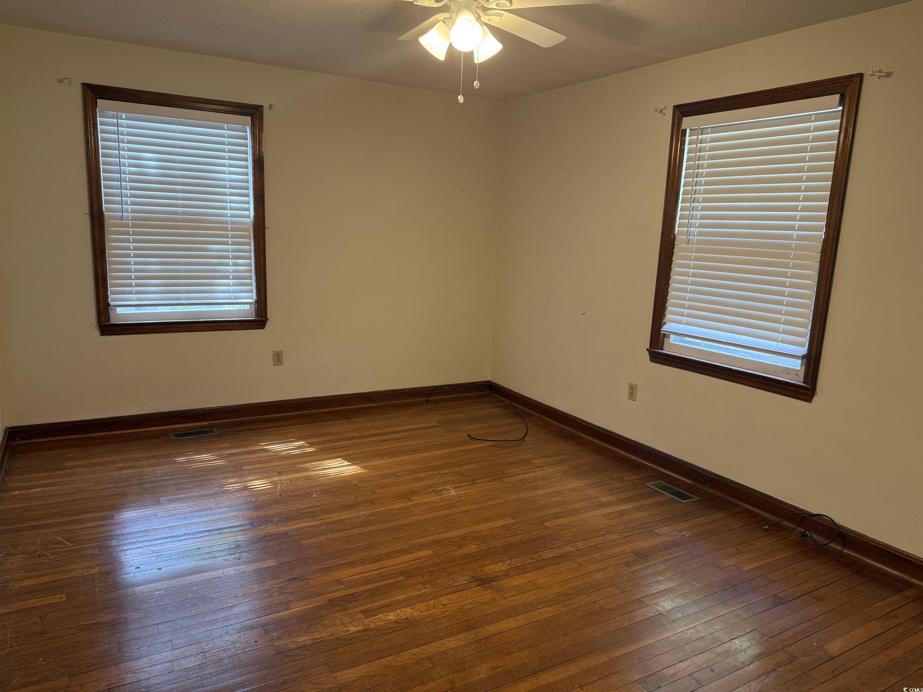 1208 Richmond Drive Georgetown, SC 29440 - Photo 8 of 9 Unfurnished room featuring hardwood / wood-style f
