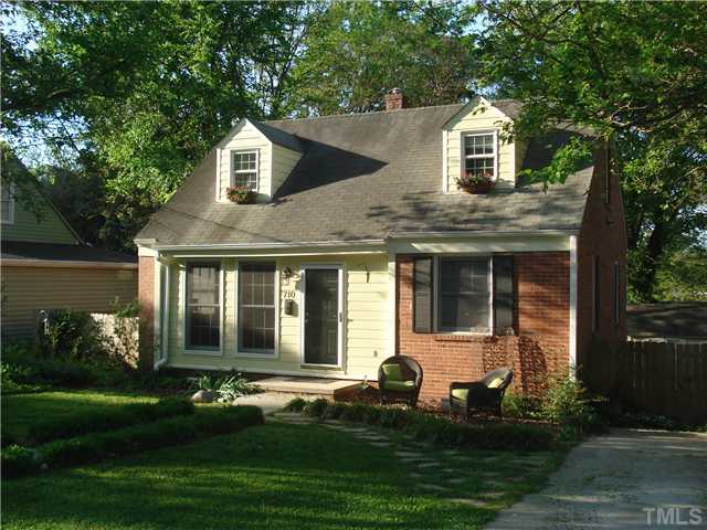 710 New Raleigh, NC 27608 - Photo 1 of 25 a front view of a house with a yard