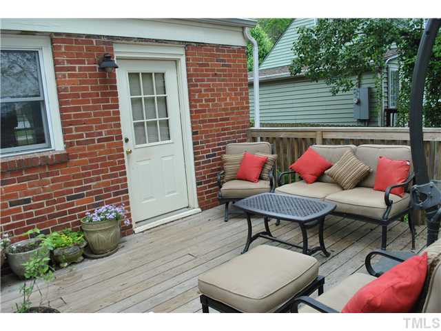 710 New Raleigh, NC 27608 - Photo 20 of 25 a outdoor sitting area with furniture and wooden floor