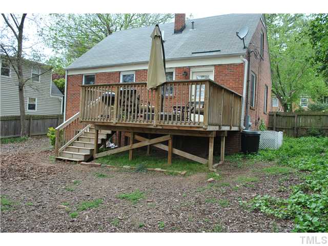 710 New Raleigh, NC 27608 - Photo 3 of 25 a view of a house with a yard and deck