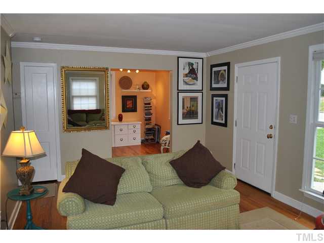 710 New Raleigh, NC 27608 - Photo 6 of 25 a living room with furniture and a lamp