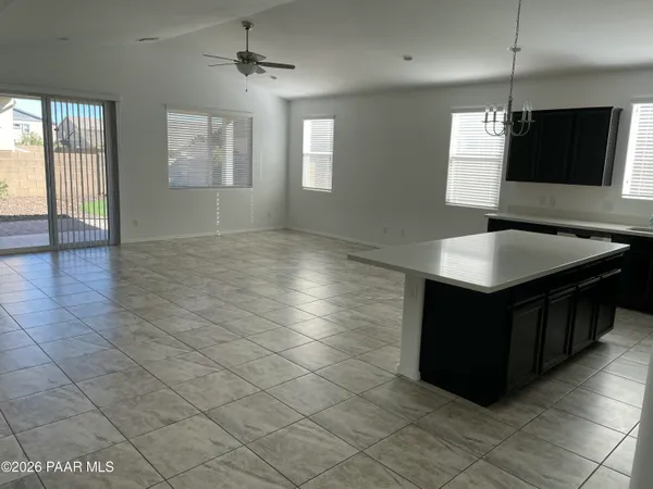 a kitchen with stainless steel appliances granite countertop a sink and a microwave