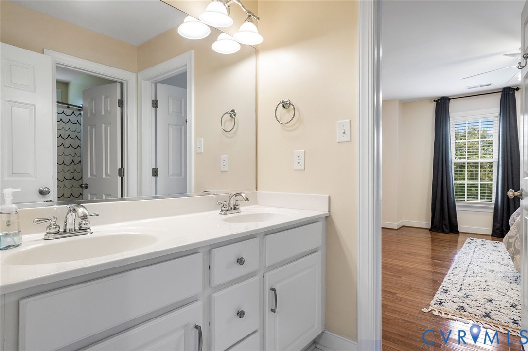 2319 Founders Bridge Road Midlothian, VA 23113 - Photo 38 of 50 Bathroom featuring double vanity and wood finished
