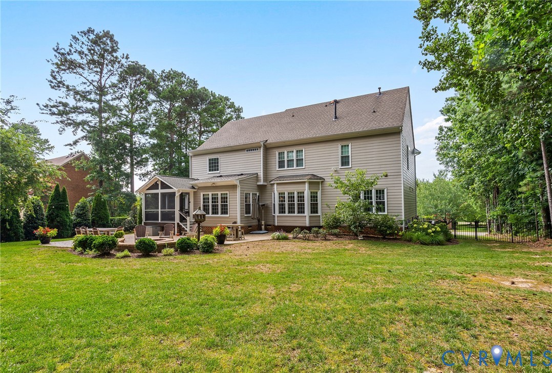 2319 Founders Bridge Road Midlothian, VA 23113 - Photo 47 of 50 Rear view of house featuring a sunroom, a patio, a