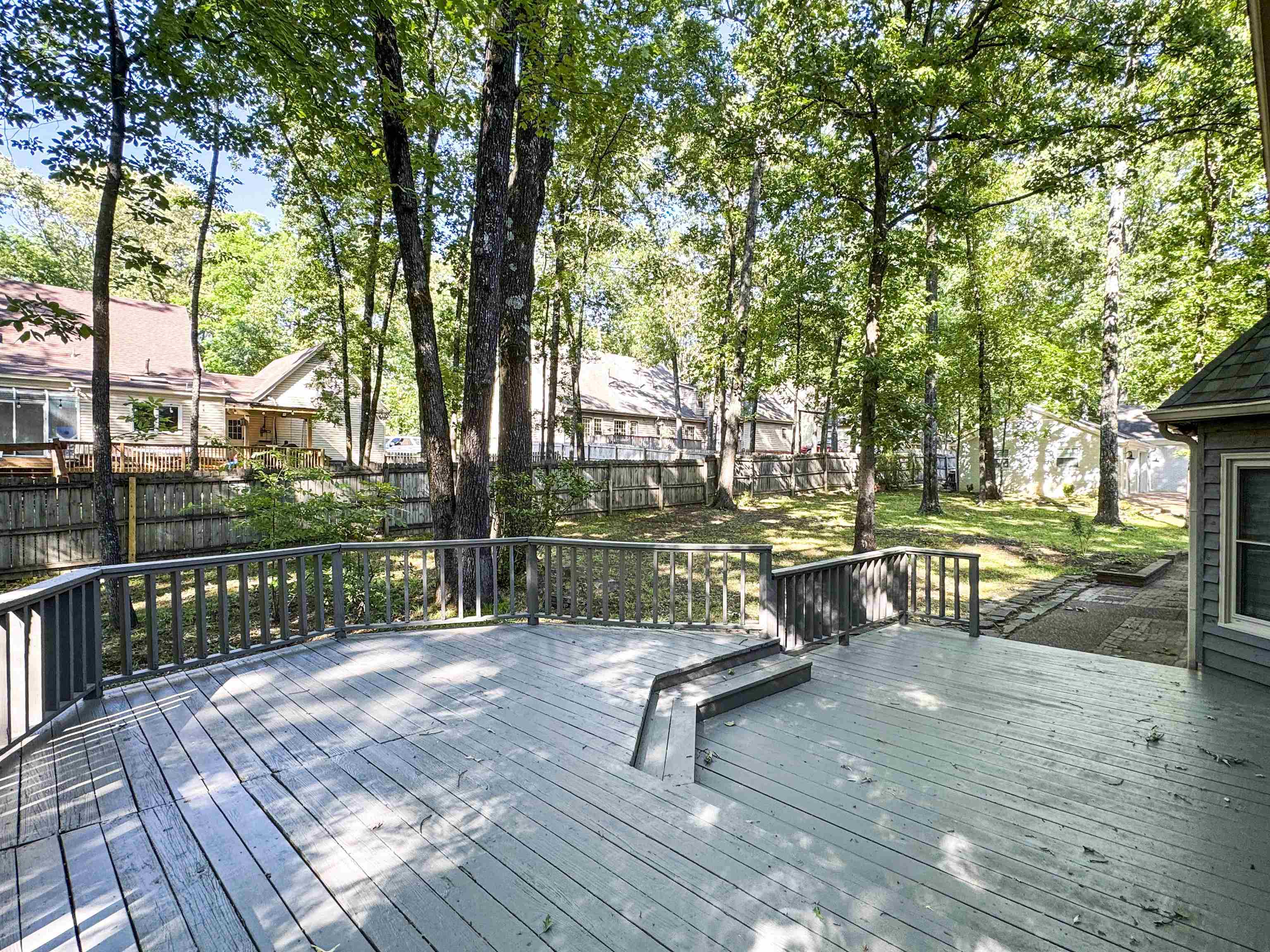 832 South Tree Drive Collierville, TN 38017 - Photo 4 of 40 Expansive wooden deck featuring perimeter railing, integrated steps, and a spacious outdoor area