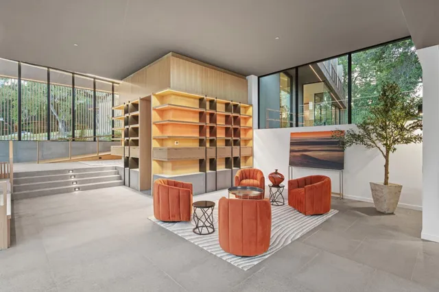 a view of balcony with floor to ceiling windows with wooden floor